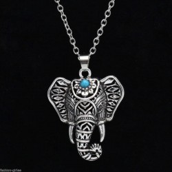 Collar de acero estilo plata envejecida diseñado con un colgante de cabeza de elefante y turquesa azul