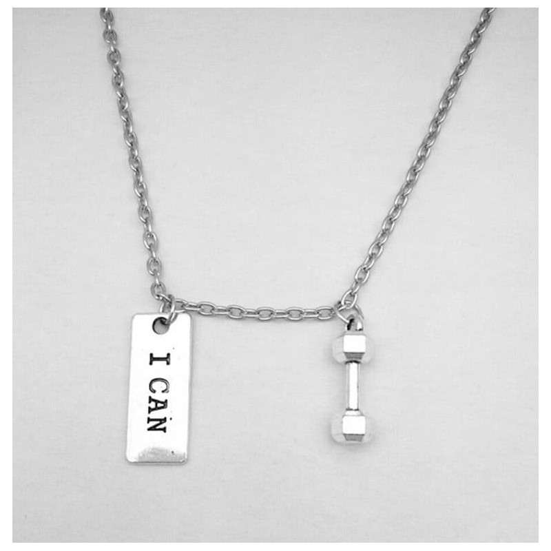 Colgante circular de acero inoxidable con la frase grabada "Yo Puedo" y diseño de inspiración deportiva.