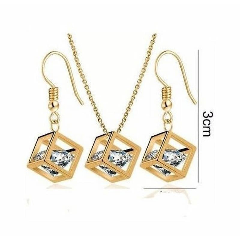 Conjunto de pendientes y collar diseñados en forma de cubo chapados en oro con grán piedra de cristal blanco