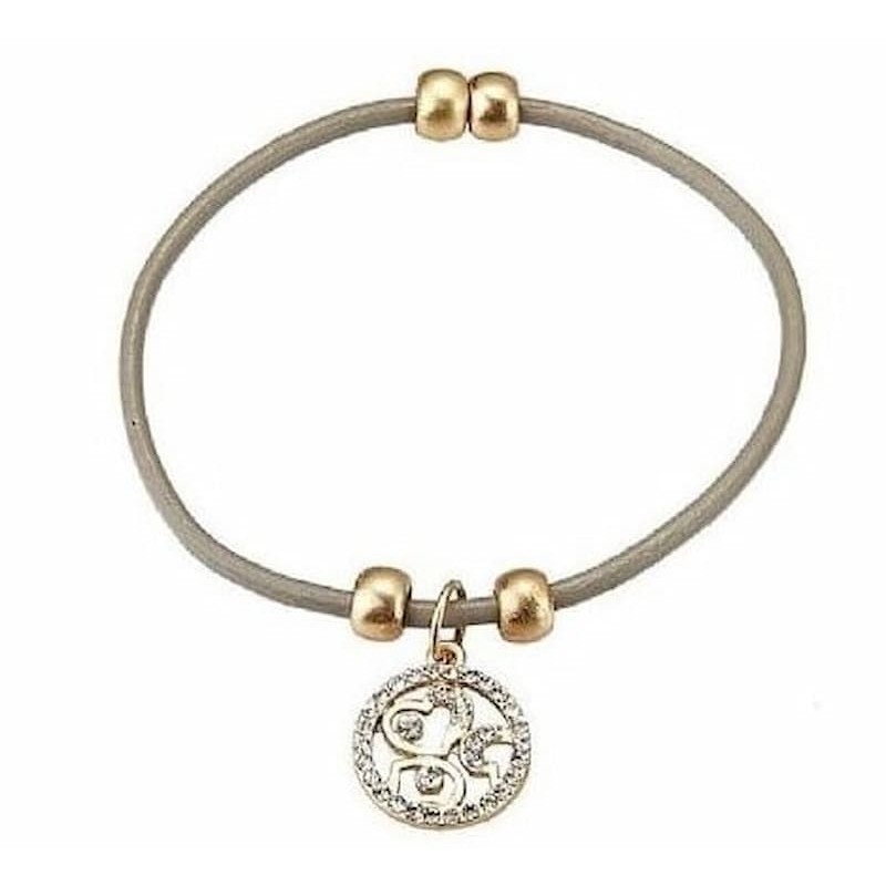 Pulsera de piel para mujer con diseño de hilos entrelazados y cierre magnético de metal pulido.