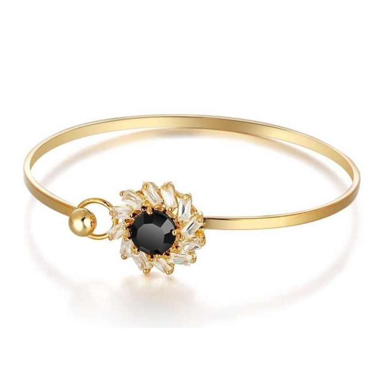Brazalete rígido de acero inoxidable para mujer con incrustaciones de piedras negras facetadas y acabado pulido.