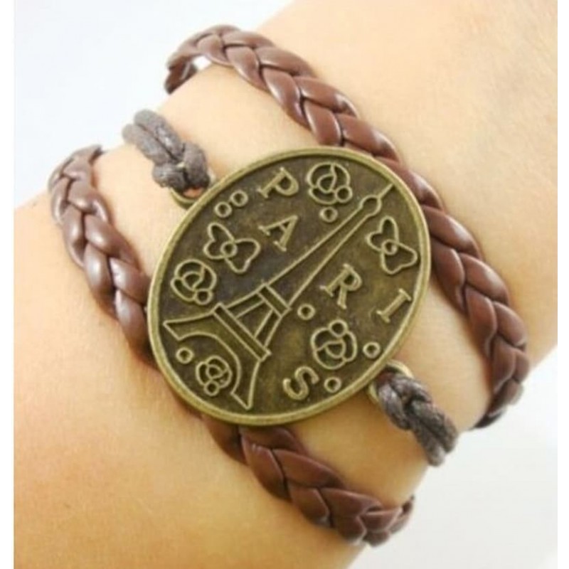 Pulsera de piel sintética negra con placa central circular de acero grabada con la palabra París.
