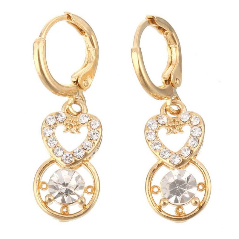 Pendientes de botón con un acabado dorado que enmarcan cristales tallados y transparentes que reflejan la luz de forma intensa.