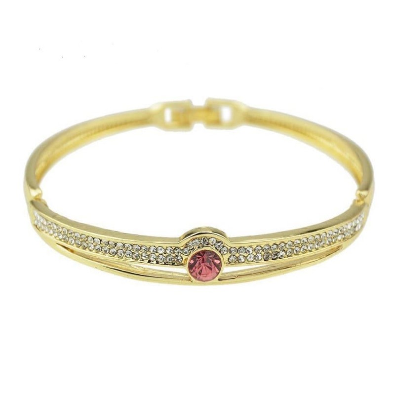 Brazalete rígido de acero inoxidable para mujer con piedra central de cristal rojo facetado y acabado espejo.