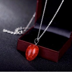 Conjunto de collar y pendientes con piedras de color rojo