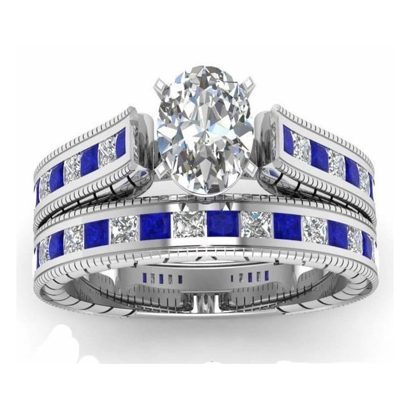 Conjunto de dos anillos para el mismo dedo con gran circón central blanco y cristales brillantes.