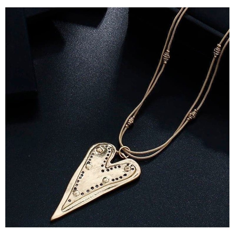 Collar con cadena fina y colgante en forma de triángulo minimalista bañado en oro de 9 quilates.