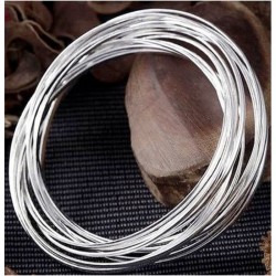 Pulsera de plata para mujer con diseño de diez círculos chapados entrelazados en una estructura de cadena múltiple.