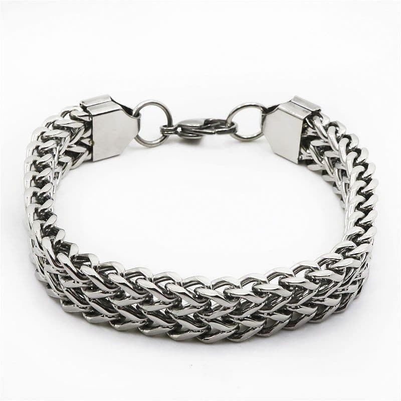 Pulsera masculina de eslabones anchos (13 mm) fabricada en acero inoxidable con acabado pulido brillante.