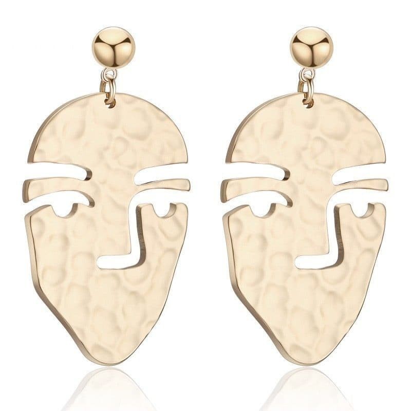 Pendientes de metal con diseño calado de cara humana en una sola línea, estilo artístico y moderno.