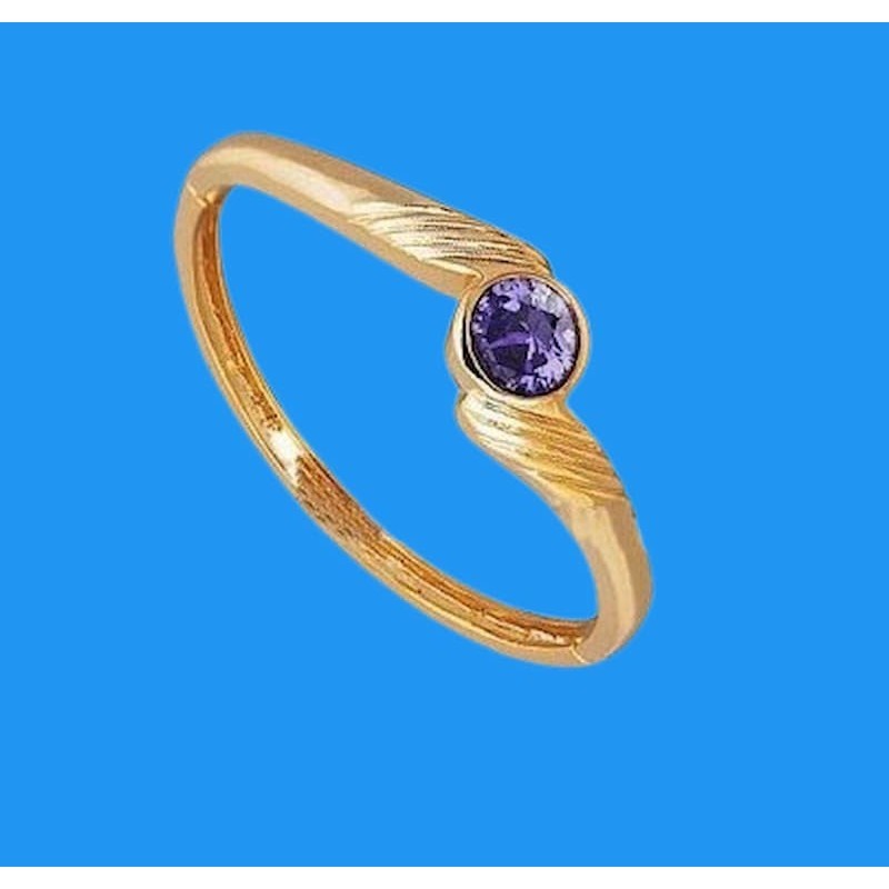 Pulsera con acabado en oro de 9 quilates con una gran piedra de cristal azul zafiro central rodeada de detalles dorados.