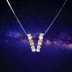 Colgante de inicial letra V en plata de ley 925 engastado con piedras naturales de topacio brillante y citrino amarillo.