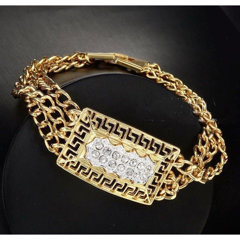 Brazalete con piedras de cristal blanco y acabado oro 14k