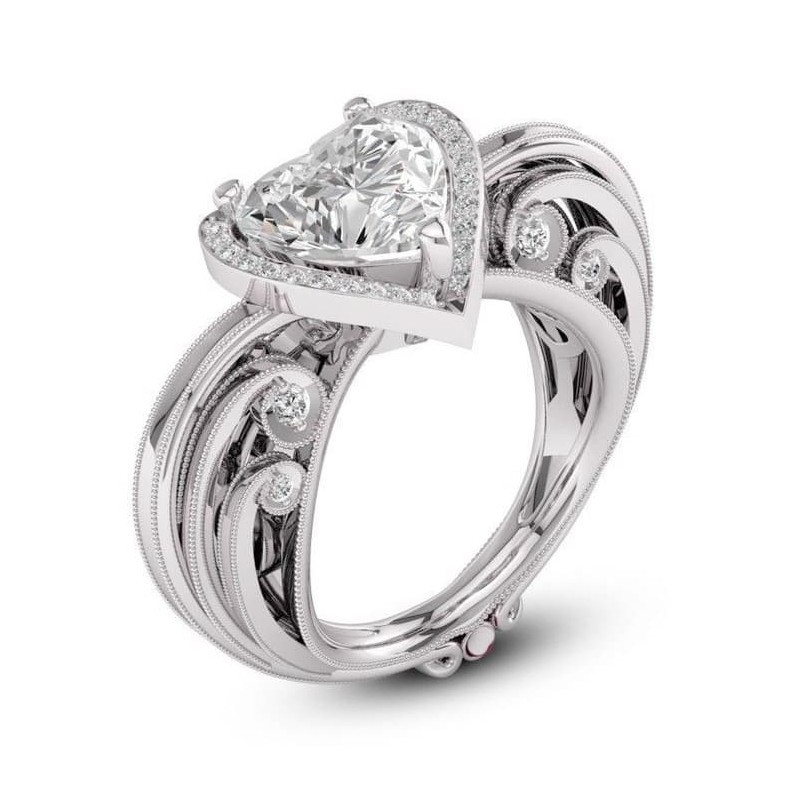Anillo de acero inoxidable con gema central en forma de corazón color topacio para mujer.
