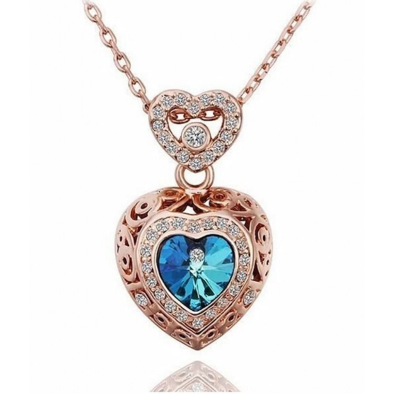 Collar largo de acero inoxidable para mujer con un colgante de corazón en cristal azul intenso.