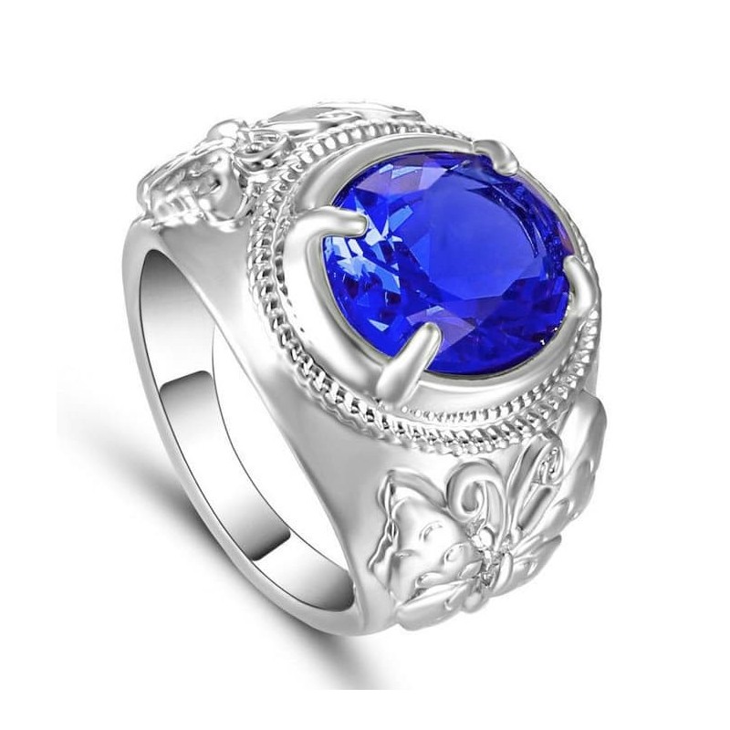 Anillo de mujer con chapado en plata y una gran piedra central de cristal azul facetado.