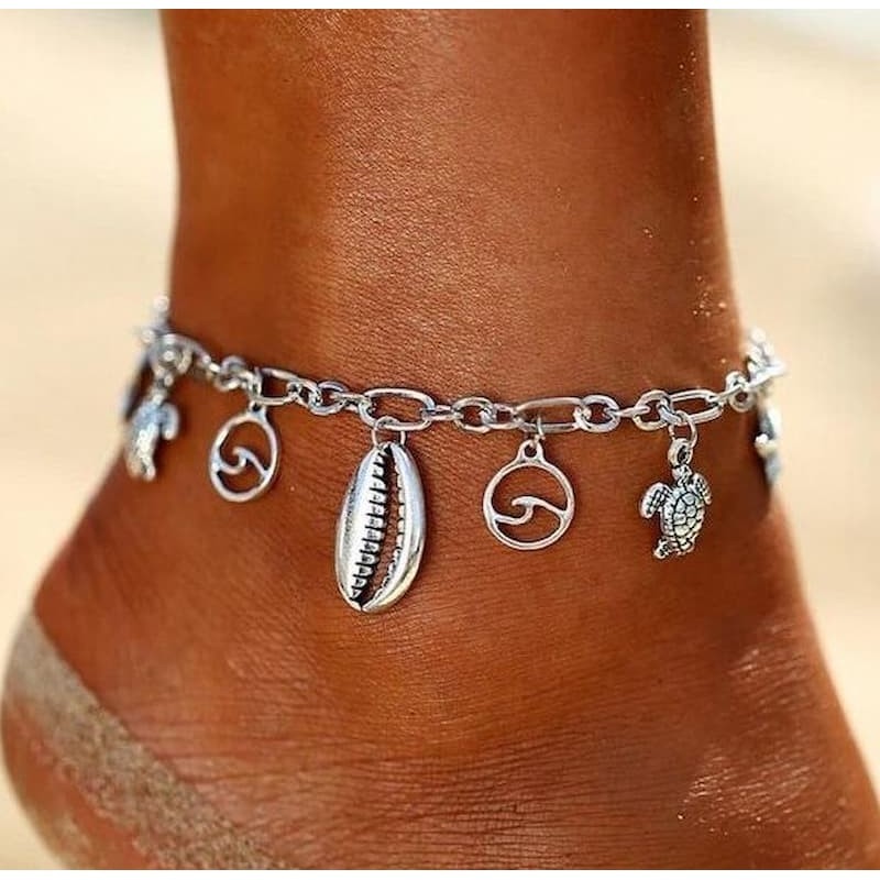 Pulsera multifunción de acero inoxidable con encantos colgantes chapados en plata de ley y cierre ajustable.