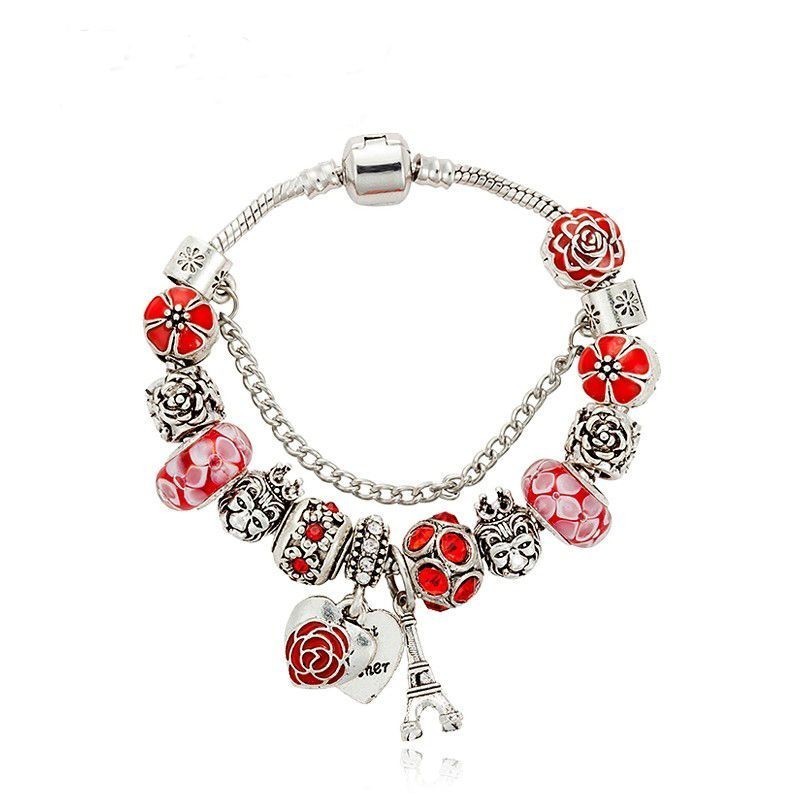 Pulsera de cadena de acero inoxidable con dijes colgantes de la suerte (trébol, mano de Fátima y ojo) con acabado pulido espejo.