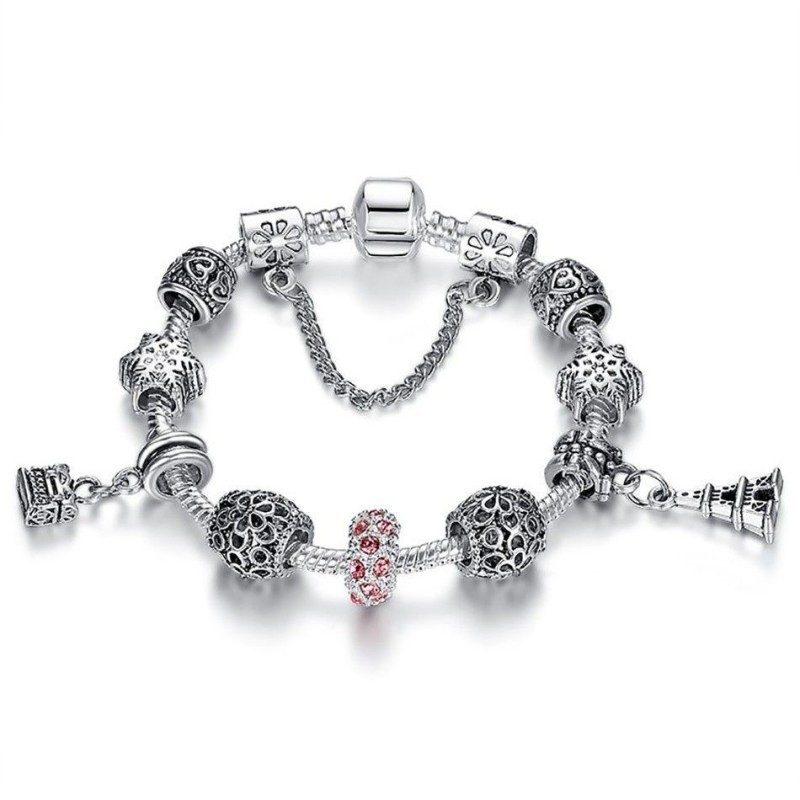 Pulsera de cadena de acero inoxidable bañada en plata con un cristal facetado en color rosa suave y acabado pulido espejo.