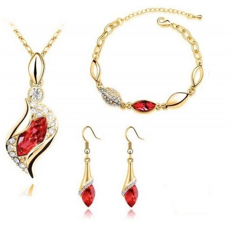 Set completo de joyería en acero chapado en oro de 18 quilates con cristales rojos facetados en talla brillante.
