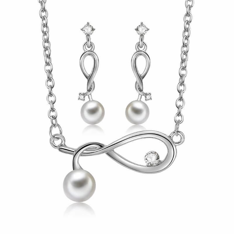 Conjunto nupcial de gargantilla y pendientes a juego fabricados en acero inoxidable con acabado plata y perlas blancas redondas.