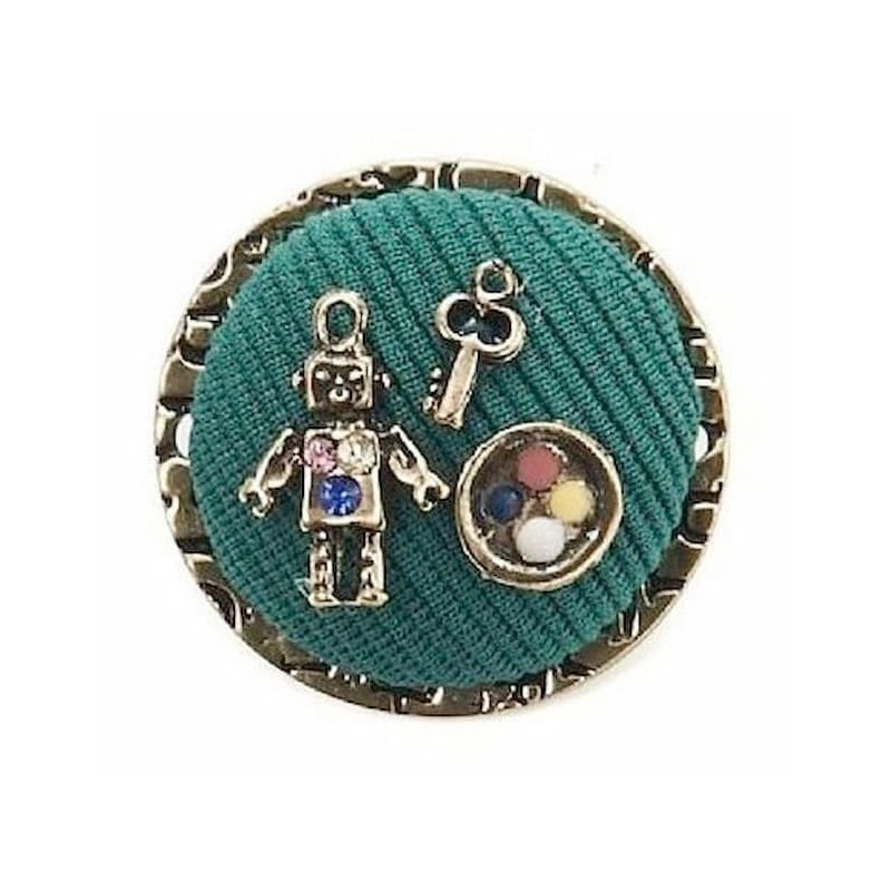 Broche decorativo para mujer con forma de robot articulado adornado con cristales brillantes de alta calidad.